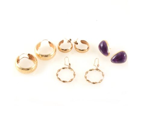 Six pairs of gold coloured earrings for pierced ears, one pair set with amethyst, hoop earrings and one pair of studs, some h