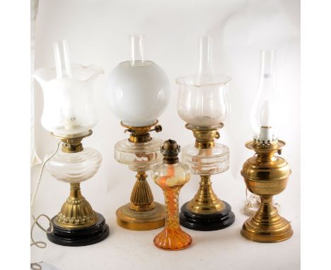 A brass oil lamp, festooned moulded glass reservoir, frosted glass shade, complete with chimney, adapted as a table lamp, 59c