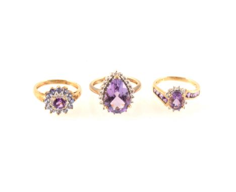 Three amethyst dress rings all set in 9 carat yellow and white gold, a pear shaped amethyst surrounded by twenty one 8 cut di