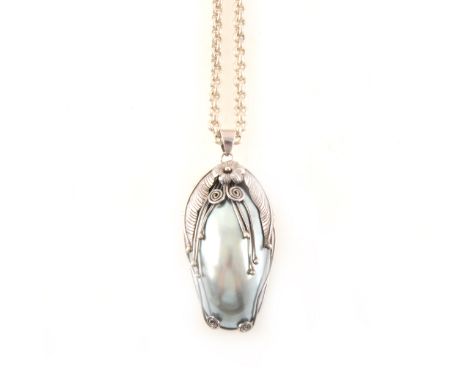 A large silver and pearl pendant and chain, the grey pearl set in a white metal frame with leaves and flowers, overall 60mm x