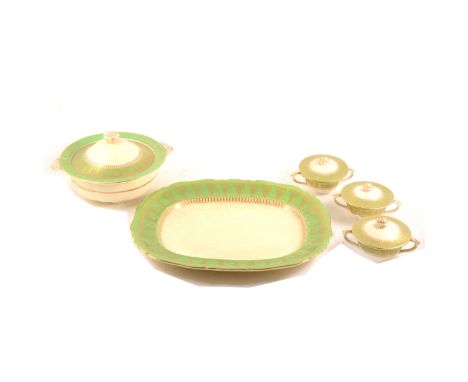 An Ashworth Brothers pottery dinner service, green and gilt banded decoration against a cream ground