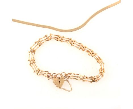 A 9 carat yellow gold modern three bar gate link bracelet, 5mm wide, fitted with a padlock fastener, approximate weight 3.8gm