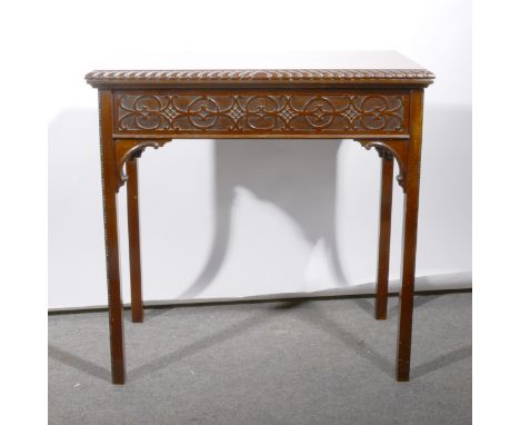 A mahogany card table, rectangular foldover top, with a gadrooned edge, tooled leather interior, blind fretwork frieze, squar