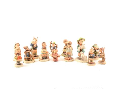 Thirteen Hummel figures, including Doctor, Playmates, and Little Hiker.