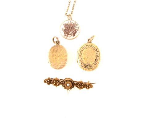 An etruscan style 40mm bar brooch with seed pearl to centre, marked 15ct, base metal pin, two yellow metal lockets with decor