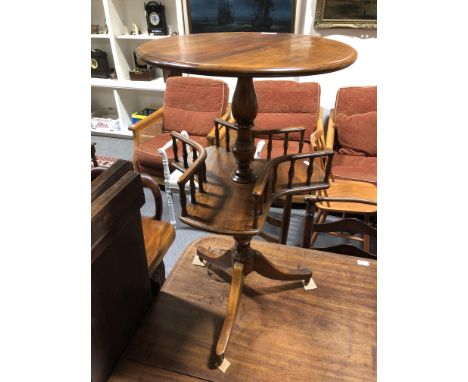 A mahogany pedestal wine table, circular top, galleried undertier, on tripod legs, diameter 44cm, height 76cm.