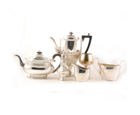 A George III style plated three-piece teaset, of plain oval form, teapot with wooden handle and finial, 17cm; a Regency patte