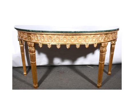 A reproduction bowfront console table, inspired by William Kent, marble top, the frieze with paterae and anthemion pendants, 