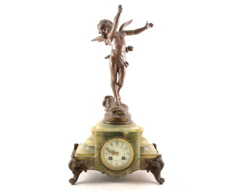 A French onyx and spelter mantel clock, circular enamelled dial, cylinder movement striking on a bell, 53cm.