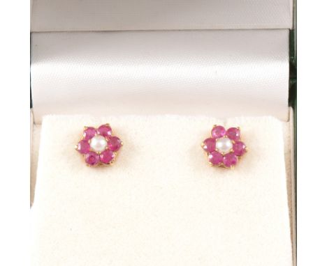 A pair of ruby and pearl cluster ear studs, six rubies surrounding a cultured pearl claw set in 9 carat yellow gold 9.5mm cir