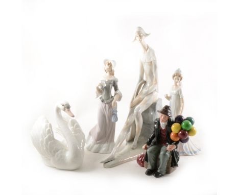 A large Nao figure of a fisherman, together with Lladro figurines, including Yachstman, stoneware Oriental series monks, Nuns