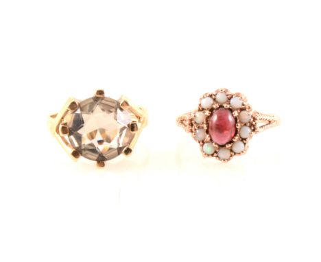 Two vintage gemset dress rings, a 12mm circular pale smoky quartz set with eight large claws in a 9 carat yellow gold mount h