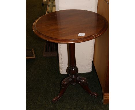 Mahogany lamp table raised on a tri-pod base