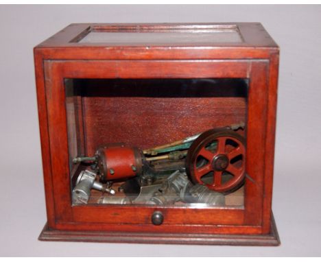 Precision made steam engine flywheel in a glazed mahogany case along with other modelling items CONDITION REPORT; Available o