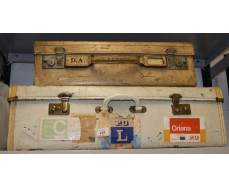 Two vintage suitcases, one with shipping lables CONDITION REPORT; Available on request. Catalogue descriptions and condition 