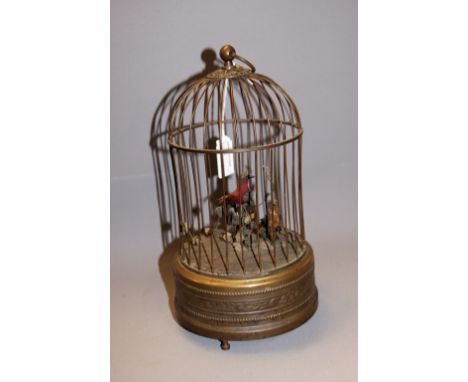 A clockwork automaton bird cage, brass with two chirping feathered birds within, in full working order. CONDITION REPORT; Ava