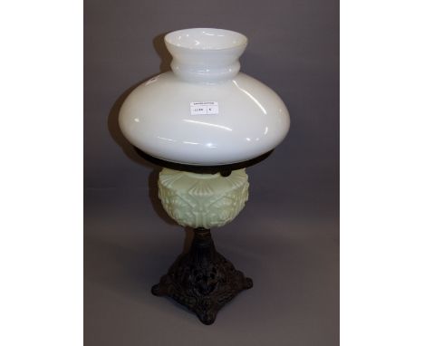 A Victorian cast-iron and coloured glass oil lamp CONDITION REPORT; Available on request. Catalogue descriptions and conditio