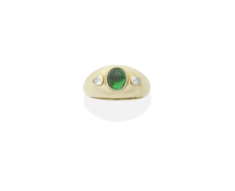 CARTIER: EMERALD AND DIAMOND RING, 1988The emerald cabochon between pear-shaped diamonds, mounted in 18 carat gold, emerald v