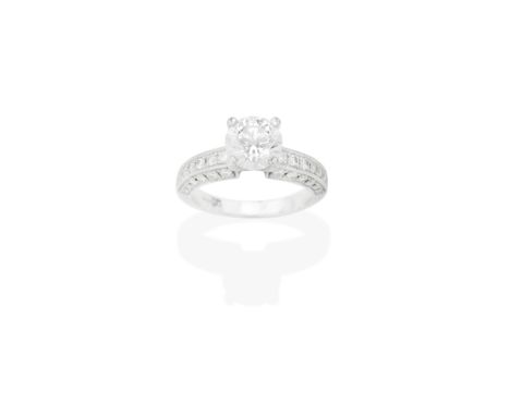 DIAMOND RINGThe brilliant-cut diamond, weighing 1.65cts, between similarly-cut diamond shoulders,  remaining diamonds approx.