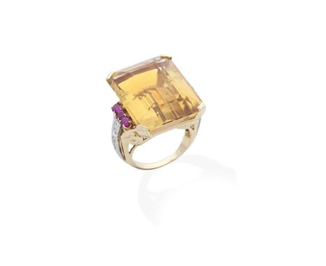 CITRINE, RUBY AND DIAMOND RING, CIRCA 1945The step-cut citrine bordered by trios of circular-cut rubies, between scrolled sho