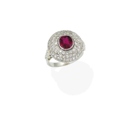 RUBY AND DIAMOND RINGCushion-shaped ruby within a bombé surround of single-cut diamonds, between trios of old brilliant-cut d