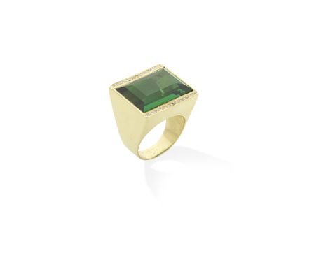 TOURMALINE AND DIAMOND RINGThe step-cut tourmaline, weighing 20.80cts, between two rows of single-cut diamonds, diamonds appr