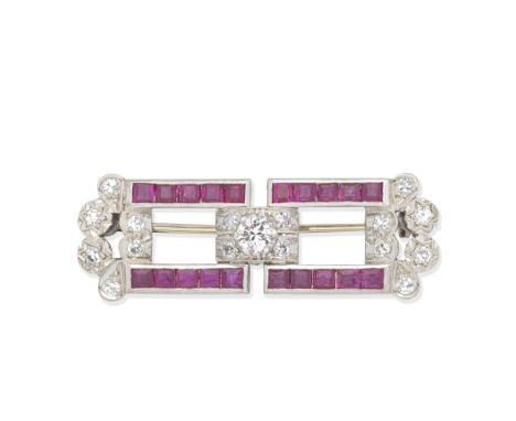 RUBY AND DIAMOND BROOCH, MID 20TH CENTURYOf openwork design, set with single and brilliant-cut diamonds and calibré-cut sapph