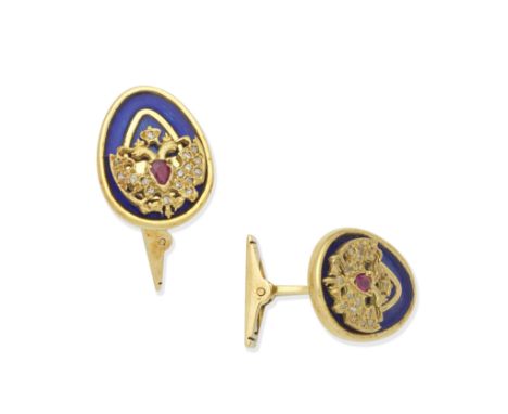 THEO FABERGÉ: ENAMEL AND RUBY CUFFLINKS, 2007Single-sided, each imperial eagle with pear-shaped ruby body, atop a blue enamel