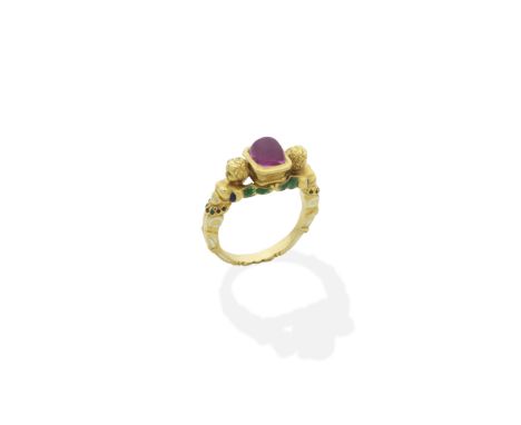RUBY AND ENAMEL RENAISSANCE REVIVAL RING, 19TH CENTURYSet with a sugarloaf cabochon ruby, the shoulders formed with two winge