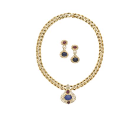 SAPPHIRE, RUBY AND DIAMOND NECKLACE AND EARCLIP SUITEThe oval cabochon sapphire between two pear-shaped ruby cabochons, withi