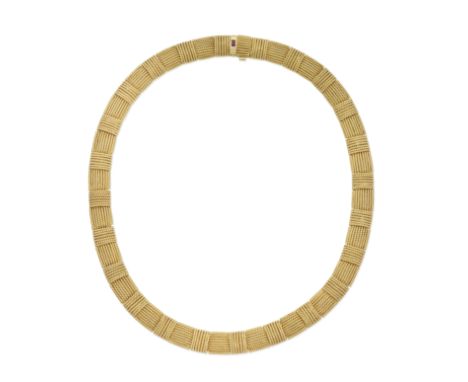 ROBERTO COIN: NECKLACEDesigned as a series of articulated ropetwist plaques, with step-cut ruby clasp, signed Roberto Coin, l