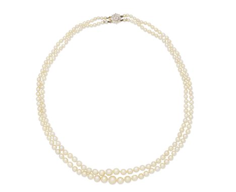 TWO STRAND NATURAL PEARL NECKLACE WITH DIAMOND CLASP, 1987The 2.8 - 7.7mm natural pearls, with brilliant-cut diamond cluster 