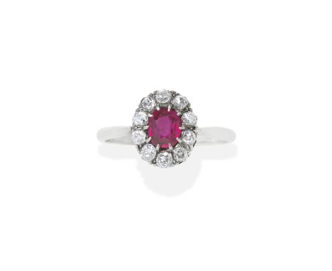 RUBY AND DIAMOND RINGThe cushion-shaped ruby within a cushion-shaped diamond surround, ruby very approx. 0.95ct, diamonds app