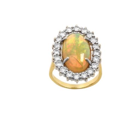 An Opal and Diamond Cluster Ringthe oval cabochon opal within a border of round brilliant cut diamonds, in white claw setting
