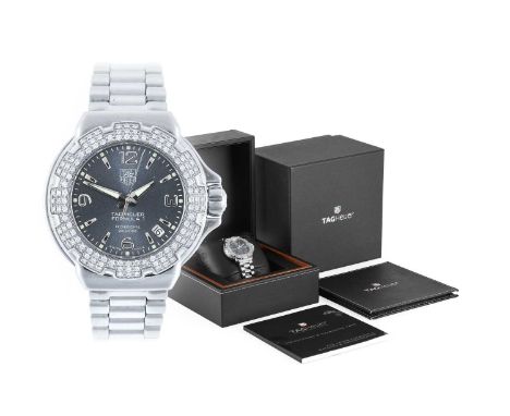 Tag Heuer: A Lady's Stainless Steel Calendar Centre Seconds Diamond Set Wristwatch, signed Tag Heuer, Professional 200 meters