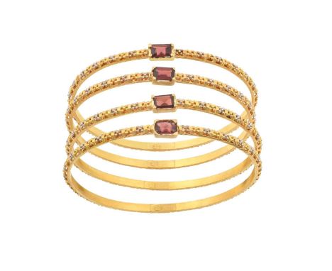 Four 22 Carat Gold Garnet Bangleseach comprises a rectangular step cut garnet in a yellow four claw setting, to a band formed