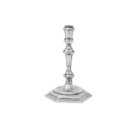 A George I Silver Taper-Candlestick, Maker's Mark Worn, London, 1719 on hexagonal base, the baluster stem terminates in spool