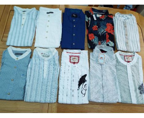 A job lot of 10 Casual Shirts, predominantly size M with a few L, unused surplus retail stock