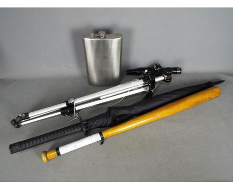An extremely large novelty hip flask, approximately 30 cm (h), an Orbit 9 30 x 30 spotting scope on tripod, a wooden baseball