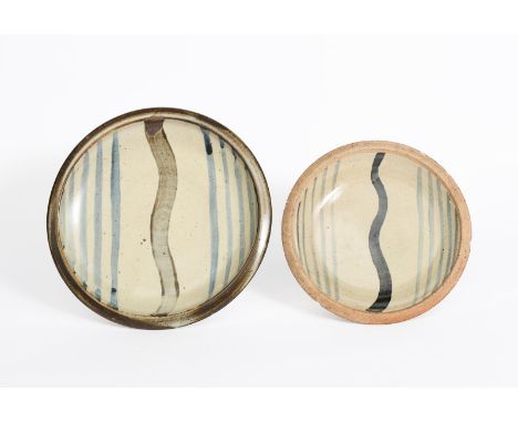 ‡ Bernard Leach, attributed a Leach Pottery plate, painted with a Willow tree motif in tenmoku and blue on a mottled ash glaz