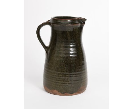 Richard Batterham (1936-2021) an early stoneware jug, covered to the foot with a green tenmoku glaze unsigned, 26cm. high Pro