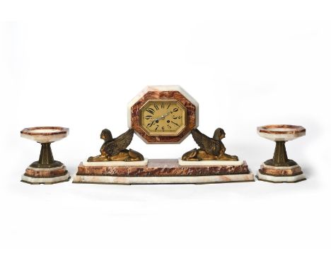 An Art Deco Egyptian Revival mantle clock garniture, comprising central octagonal red marble and onyx clock, with octagonal g
