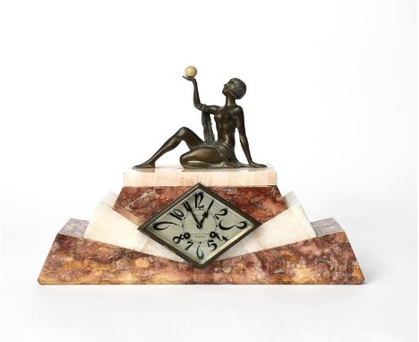 An Art Deco marble and patinated spelter mantle clock,  stepped rectangular base with panels of red veined marble and onyx, t