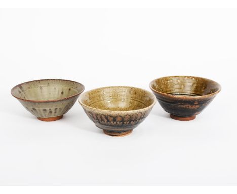 Richard Batterham (1936-2021) a stoneware footed bowl, the exterior glazed in tenmoku, the interior ash, and two other footed