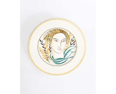 A Poole Pottery wall plate designed by Olive Bourne, pattern GZ, painted with a stylised portrait of a woman, in colours prin