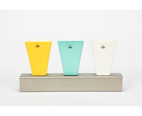 A Giotto ceramic three vase in a metal stand set designed by Johanna Grawunder,  designed 1991, three tapering ceramic pots i