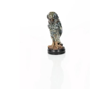 A Martin Brothers stoneware 'monk' bird jar and cover by Robert Wallace Martin, dated 1912, modelled standing, with short bro
