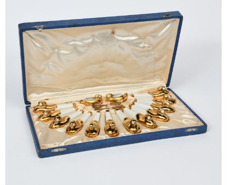 A Robj  Paris set of knife rests and salts designed by Edouard Marcel Sandoz, twelve ceramic knife rests each modelled as a s