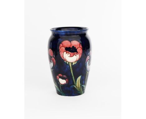 'Big Poppy' a Moorcroft Pottery vase designed by William Moorcroft, shouldered, cylindrical form, tubeline decorated with flo