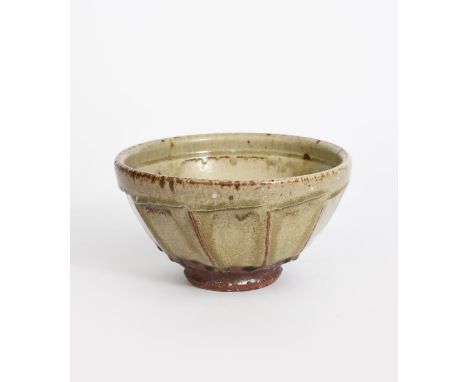 Richard Batterham  (1936-2021) a cut-sided stoneware bowl, on shallow foot, glazed with running ash glaze over River iron sli